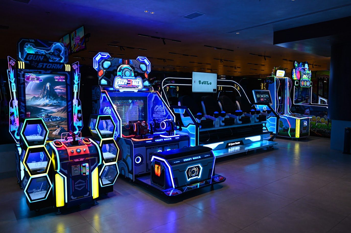 Arcade cabinets glowing at Bowlo